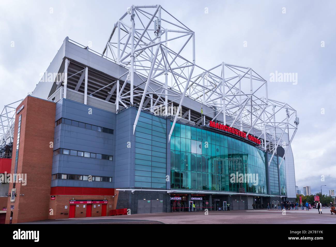 Facade of Old Trafford stadium with Manchester United's name Stock Photo