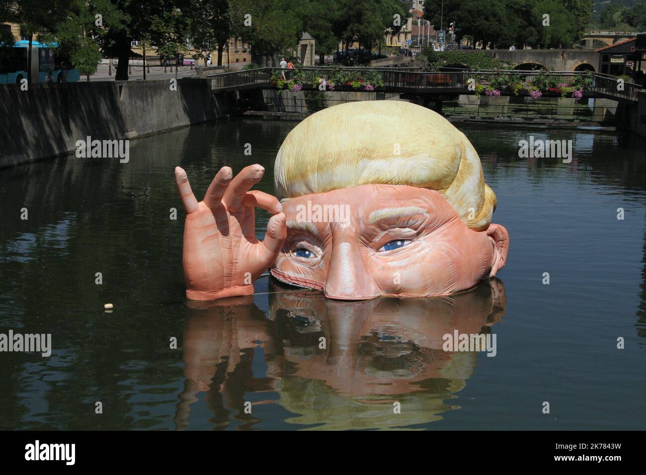The installation 'Everything is fine' depicting the half submerged head of US President Donald Trump by Jacques Rival, architect, displayed in the Moselle river as part of the digital art festival 'Constellations de Metz' in Metz, eastern France.  Stock Photo