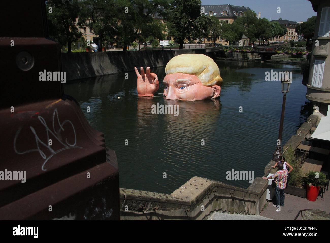 The installation 'Everything is fine' depicting the half submerged head of US President Donald Trump by Jacques Rival, architect, displayed in the Moselle river as part of the digital art festival 'Constellations de Metz' in Metz, eastern France.  Stock Photo