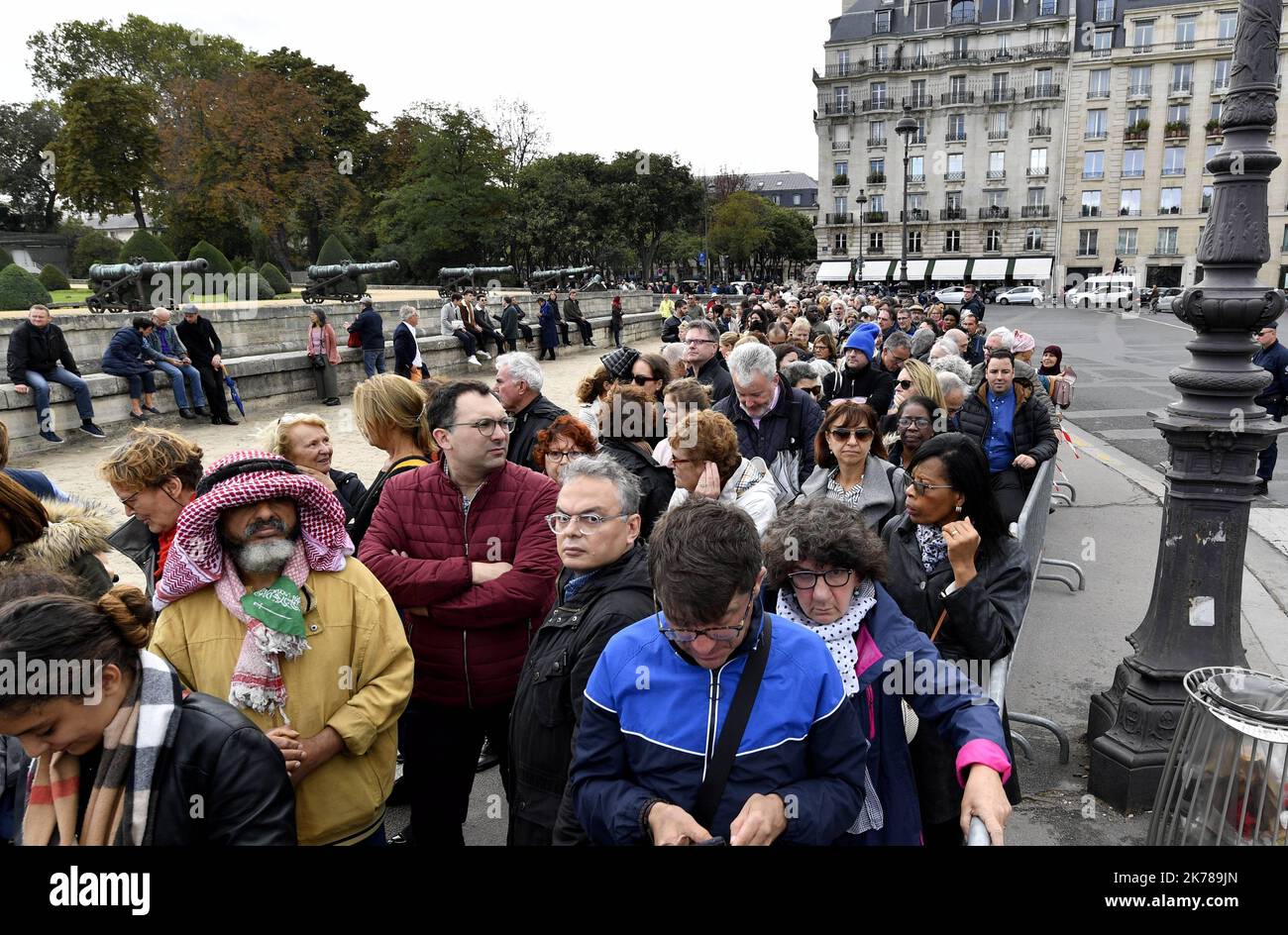 People queue at the entrance of Saint-Louis-des-Invalides Cathedral ...