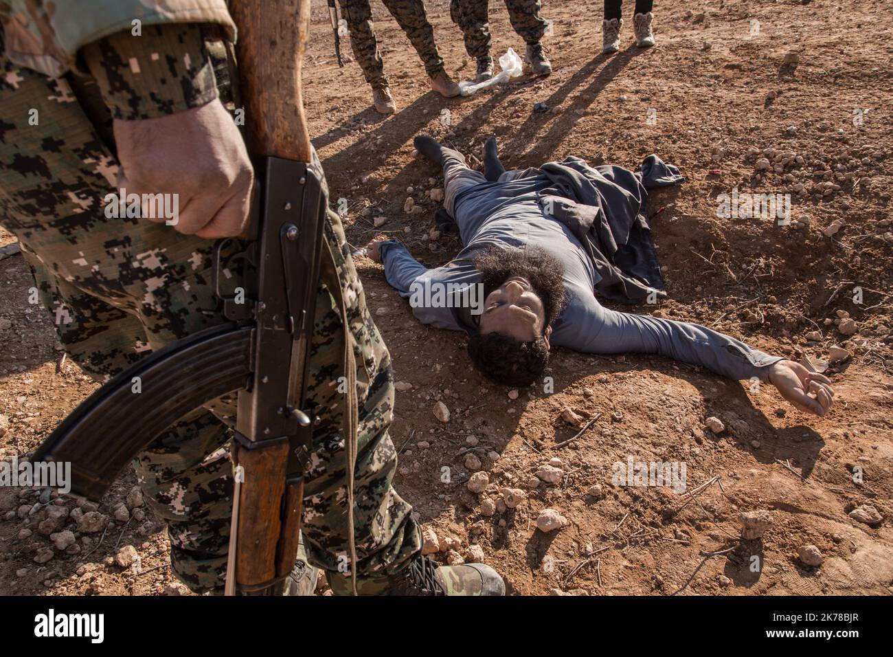 A dead body of a memeber of ISIS - the YPG platoon has just liberate the village from ISIS, this place is not far from Raqqa. Stock Photo