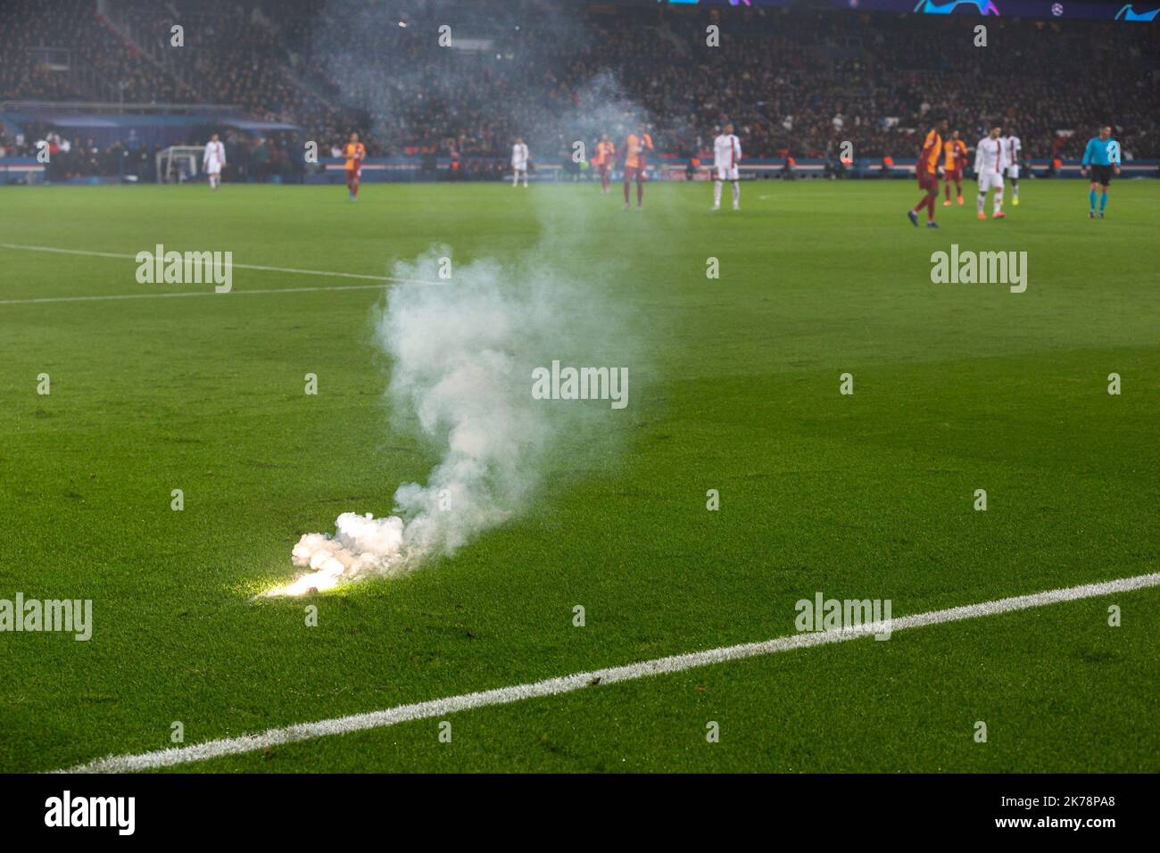 Flares are thrown onto the pitch during the game Stock Photo