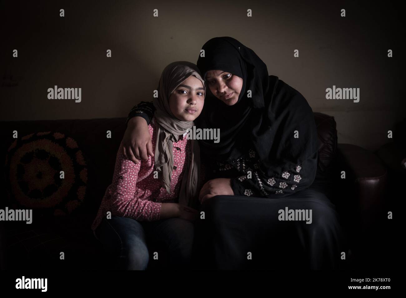 Umm Malek and Malek - Qalanfil, Egyptian Delta. Umm Malek lives in a small Muslim village in the Delta of Egypt. She was excised at 10 years old and remains deeply marked by the trauma of this event. 'We can easily forget what we ate that day, or the weather it was. But we cannot forget the pain, the fear ...' Umm Malek is now fully aware of the long-term consequences of this practice on her mental health as well as on her intimate life as a married woman. 'What we tend to ignore is that many divorces take place because of this barbaric practice. Both men and women become sexually frustrated,  Stock Photo