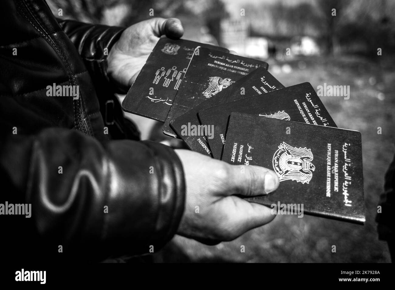 A man shows his family's Syrian passports. Three days ago after President Erdogan's announcement to open the borders, thousands of refugees gathered in the Edirne region in the hope of rallying Greece. March 2, 2020. Pazarkule, Turkey. Stock Photo