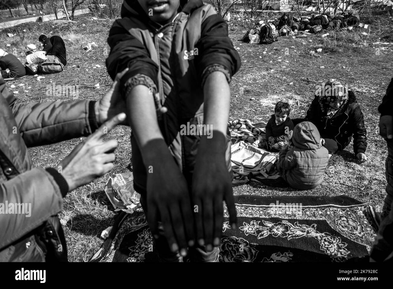 A man from Syria shows the broken arm of his child. he was hit by a car. According to the parents, no hospital wants to take care of the child. Three days ago after President Erdogan's announcement to open the borders, thousands of refugees gathered in the Edirne region in the hope of rallying Greece. March 2, 2020. Pazarkule, Turkey. Stock Photo