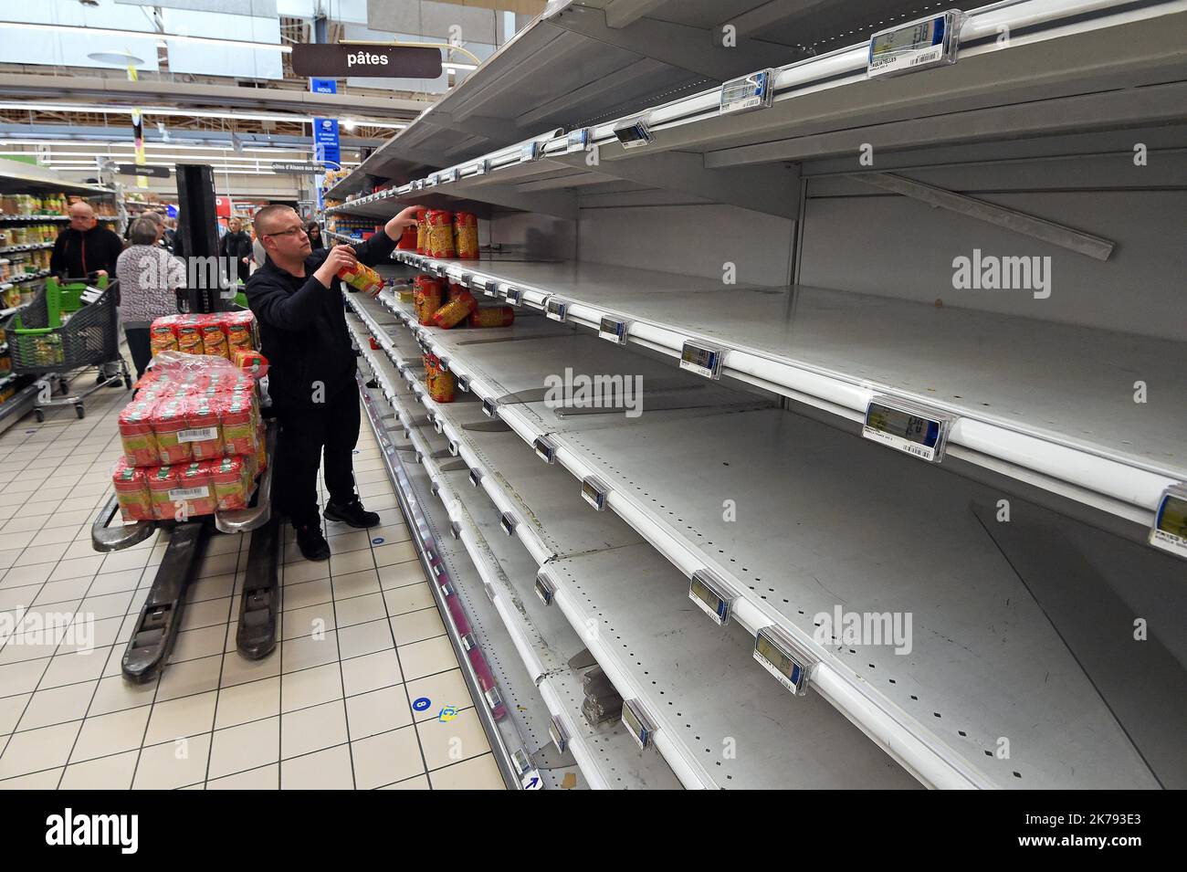 The pasta department of the Cora Houdemont shopping center has been robbed. Coronavirus panic-buying leading to empty shelves, and wait long lines   France march 14 2020 Stock Photo