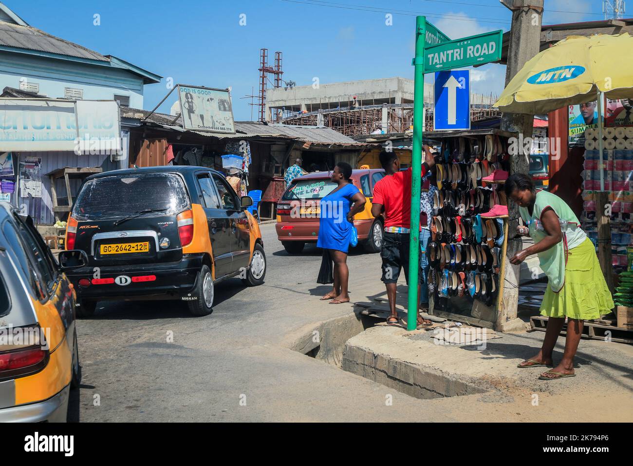 Cape Coast, Ghana - April 14, 2022: Typical African Road with Colorful Buildings near in Local Cape Coast town in Ghana Stock Photo