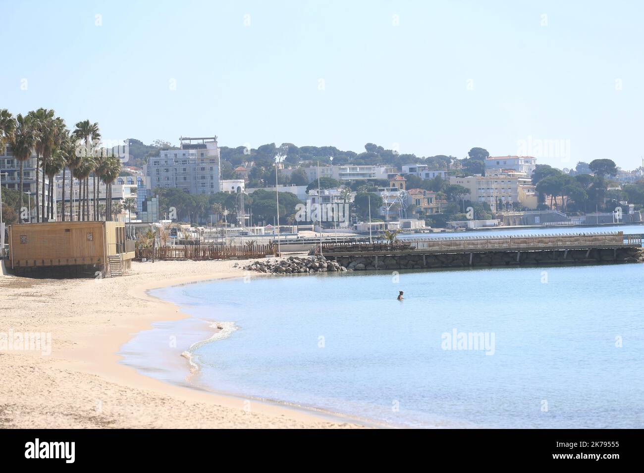 A general view of people on the French Riviera beach despite a ban on access to the beaches of Golfe-Juan Vallauris being introduced due to the Coronavirus epidemic Stock Photo