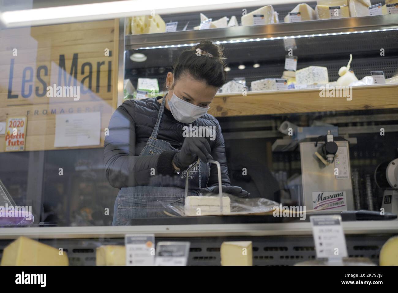 Food retailers wear masks as a precautionary measure with customers to