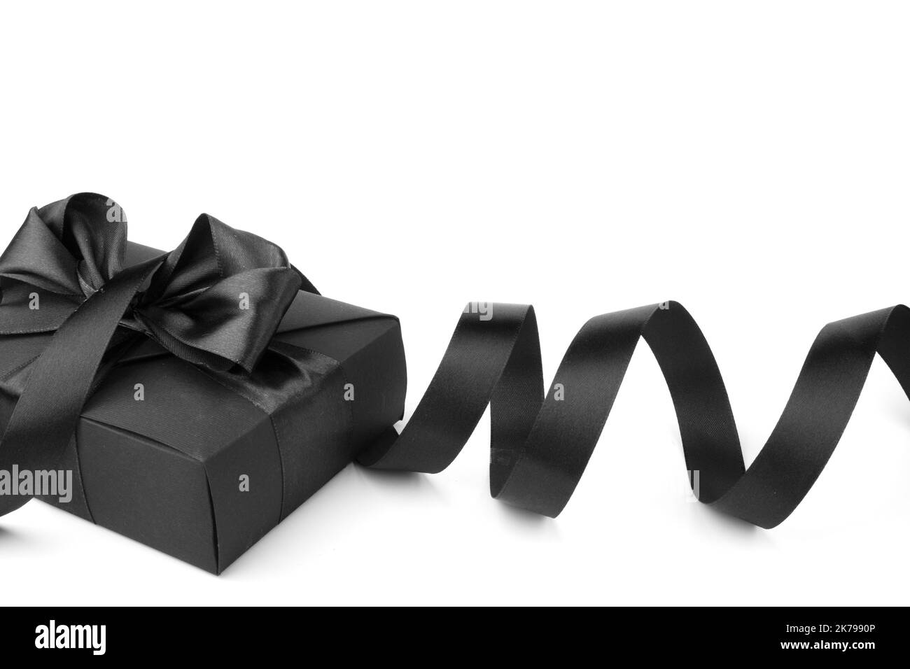 Black friday gift, paper box with silk ribbon bow isolated on white background Stock Photo