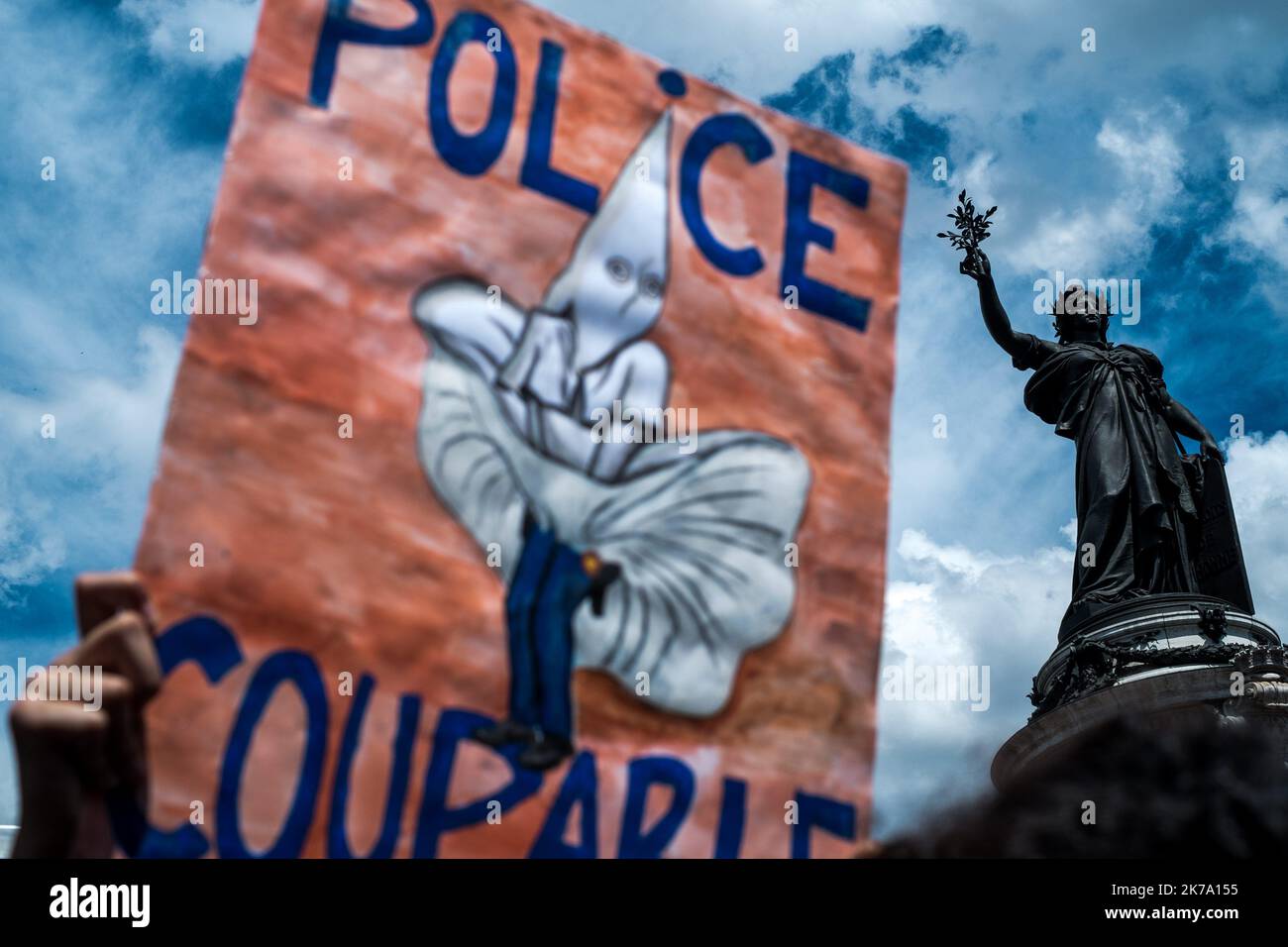 On Saturday 13 June 2020, at the call of the Truth Committee for Adama (Traore), nearly 100,000 people gathered at Place de la Republique in Paris for what was to be a march against racism and police violence. But the march, which was due to end at the Place de l'Opera, was cancelled at the last minute by the Paris police prefecture, as all avenues around the Place de la Republique were barricaded by the police. Blocked and bogged down in the square, the demonstrators have not lost their rage and indignation... Stock Photo