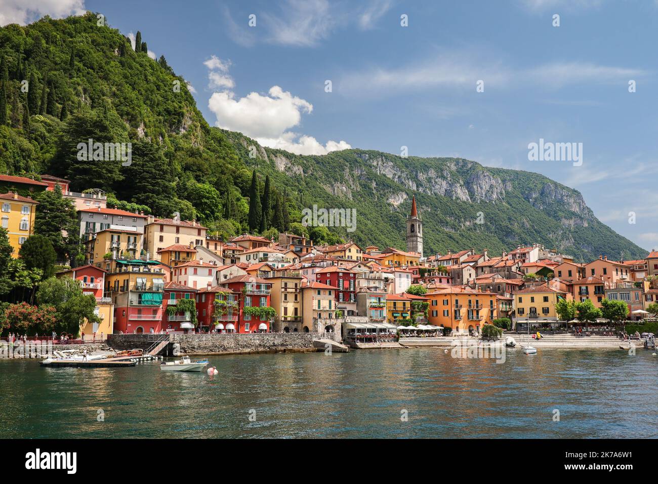 Colorful Varenna Town with Green Mountains. Picturesque Italian Comune with Lake Como during Summer Day. Stock Photo