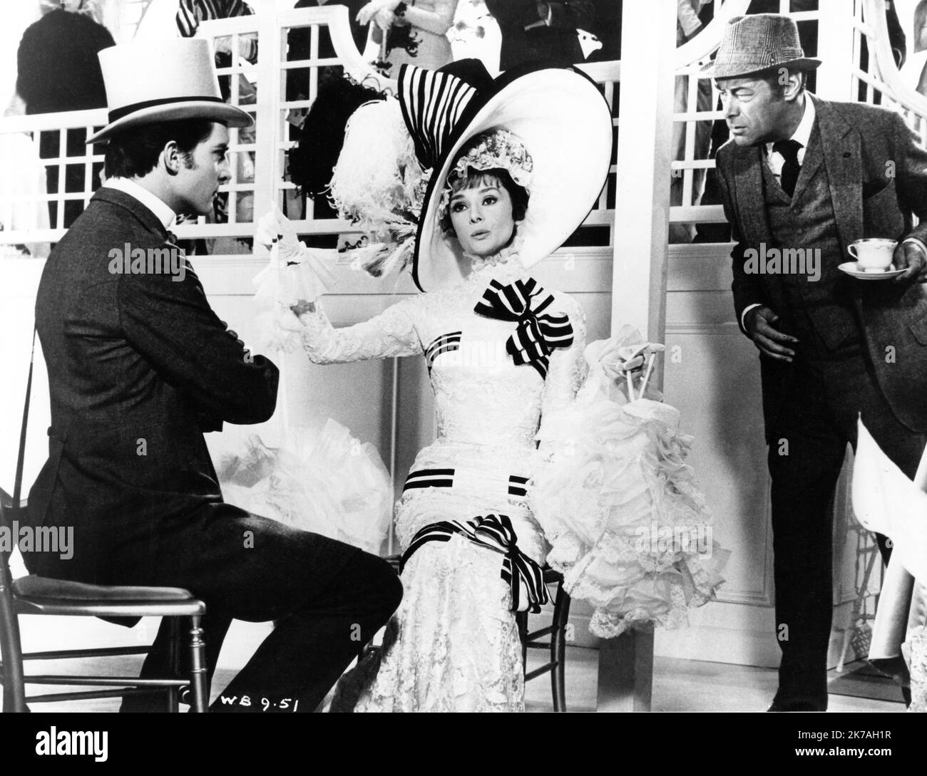JEREMY BRETT AUDREY HEPBURN and REX HARRISON in MY FAIR LADY 1964 director GEORGE CUKOR from the Broadway musical adapted from the play Pygmalion by George Bernard Shaw screenplay book and lyrics Alan Jay Lerner music Frederick Loewe production design and costumes Cecil Beaton producer Jack L. Warner Warner Bros. Stock Photo