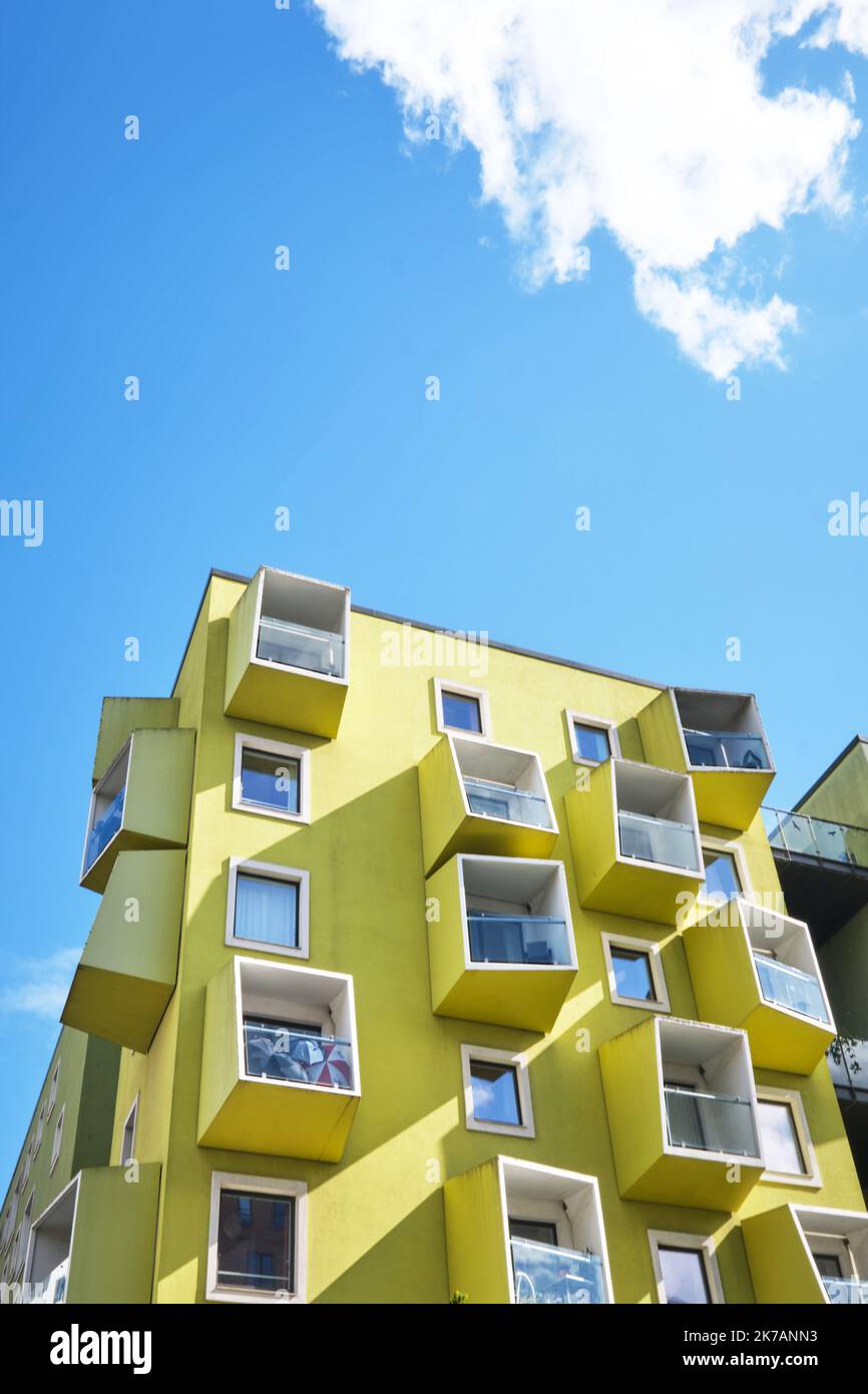 Copenhagen, Denmark - Sept 2022:  Modern green yellow cube buildings, Orestad district designed by JJW Arkitekter Ørestad Plejecenter, Senior Housing Stock Photo