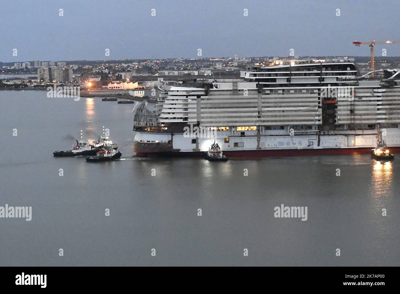 ©PHOTOPQR/OUEST FRANCE/Marc ROGER ; SAINT-NAZAIRE ; 05/09/2020 ; Changement de cale pour le paquebot : Wonder of the seas dans le port de Saint-Nazaire , aidé par les remorqueurs car le bateau n'a pas encore de moteur. - Saint Nazaire, France, sept 5th 2020 - Built at Chantiers de l'Atlantique in Saint-Nazaire, the cruise liner Wonder of the seas (the largest liner in the world) will make its first launch this Saturday, September 5, 2020. It is re-docked because it does not has no engine yet Stock Photo