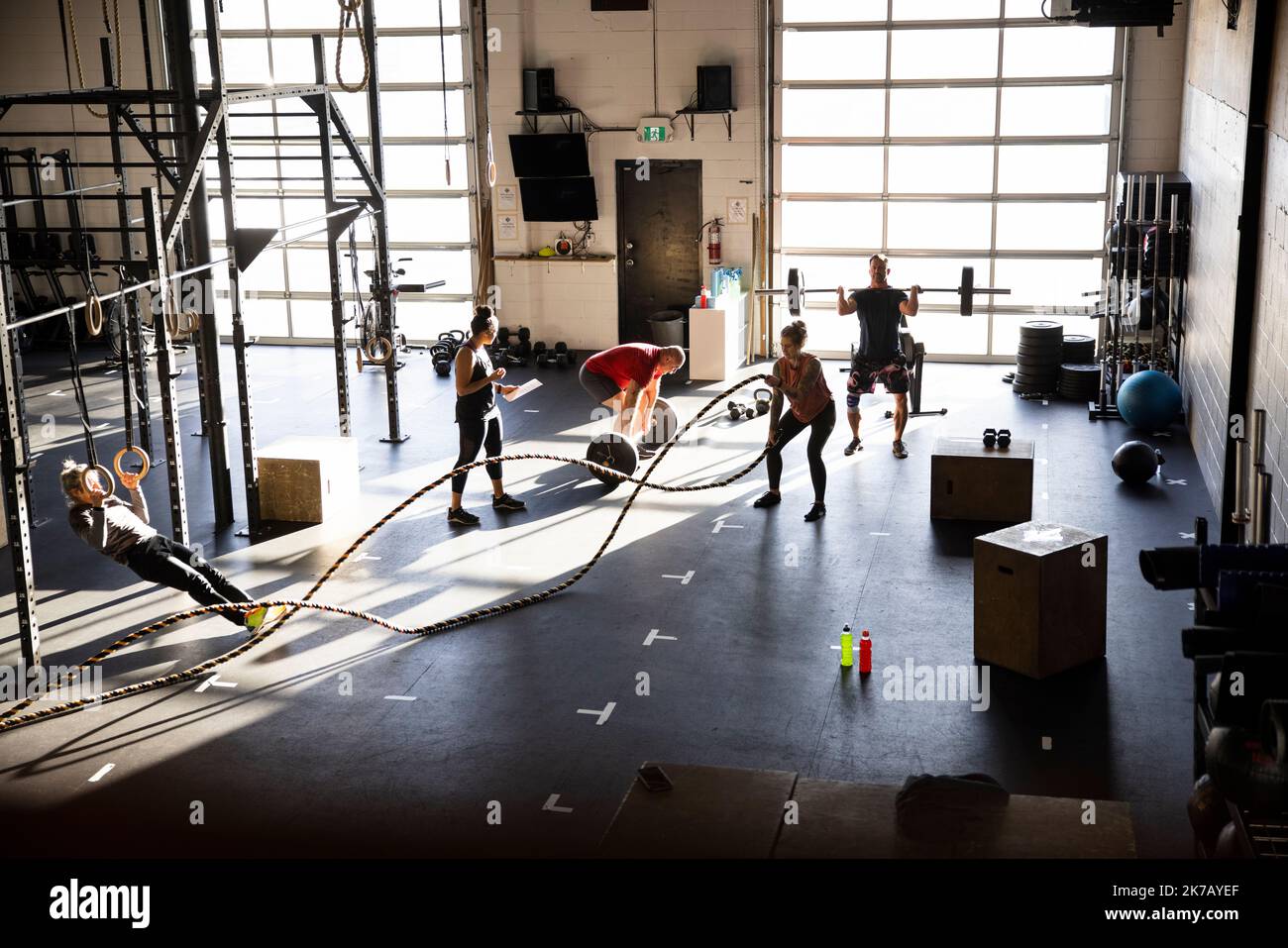People working out in cross training gym Stock Photo Alamy