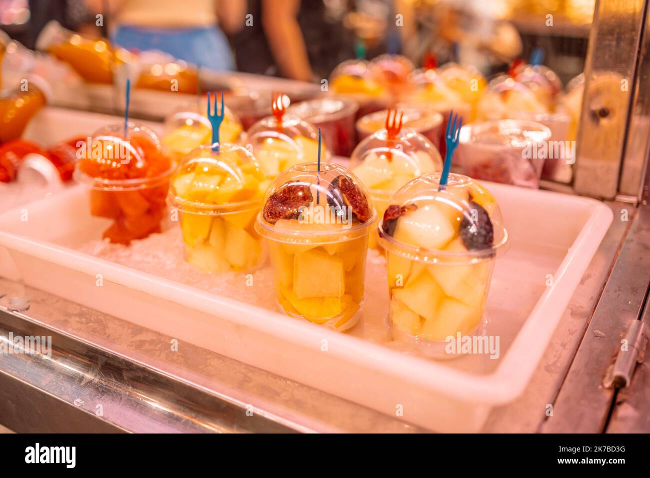 https://c8.alamy.com/comp/2K7BD3G/fresh-fruit-slicing-in-a-cup-exhibition-of-a-plastic-box-with-fresh-cut-pieces-of-fruit-in-the-store-2K7BD3G.jpg
