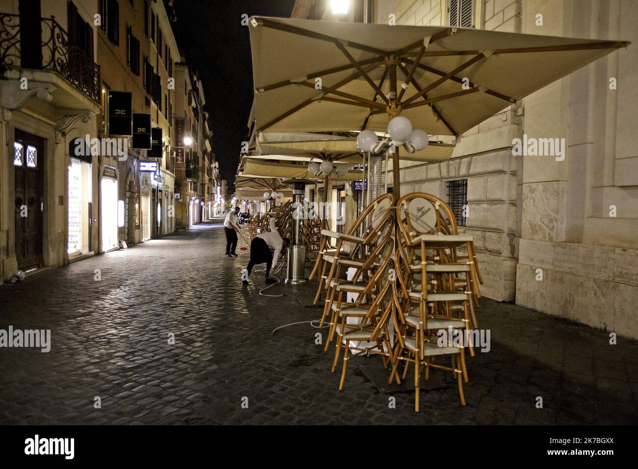 Stacked chairs are seen outside a coffee bar in Via Frattina, before a curfew imposed by the region of Lazio from midnight to 5 a.m to curb the COVID-19 infection, caused by the novel coronavirus. Rome, Italy, 24 October 2020 Stock Photo