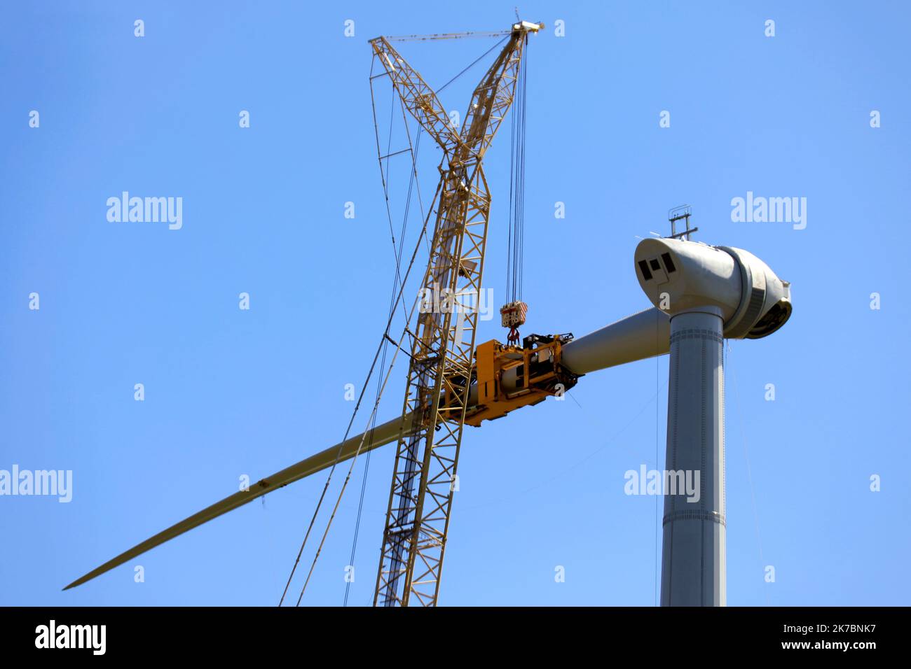 Constructing wind-turbines by using a large crane Stock Photo