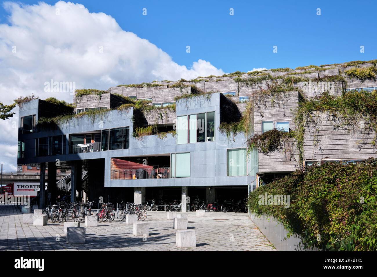 Copenhagen, Denmark - Sept 2022: Mountain shaped Housing building in Orestad city. Designed by Bjarke Ingels Group and JDS Stock Photo
