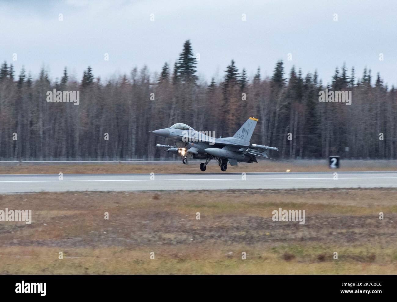 An F-16 Fighting Falcon assigned to the 35th Fighter Wing lands at Eielson Air Force Base, Alaska, during RED FLAG-Alaska (RF-A) 23-1, Oct. 8, 2022. RF-A employs the 18th Aggressor Squadron in simulating combat with the participating members to share its knowledge of adversarial tactics, techniques and procedures. (U.S. Air Force photo by Senior Airman Joao Marcus Costa) Stock Photo