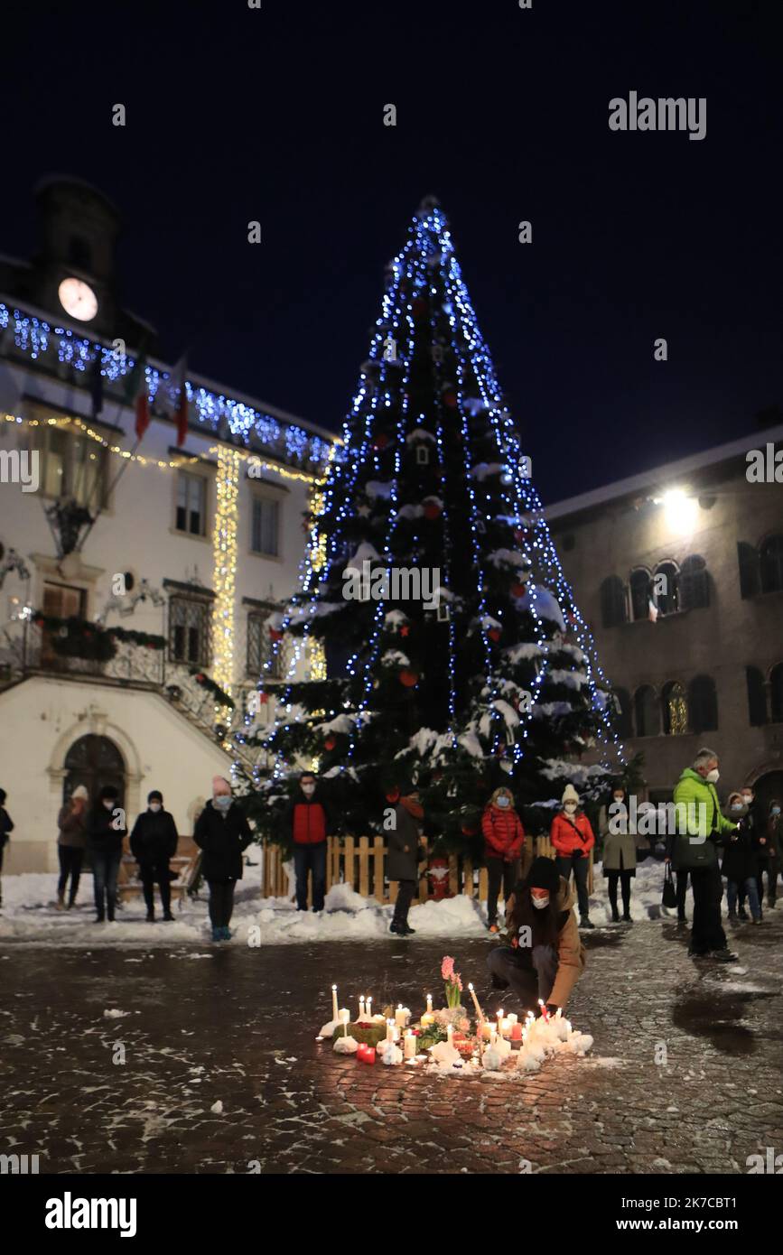 ©Pierre Teyssot/MAXPPP ; Death of Ethiopian Migrant Agitu Gudeta Ideo - La Capra Felice - Commemoration on 30/12/2020 in Pergine Valsugana, Italy. Agitu Idea Gudeta has built a thriving cheese business 'La Capra Felice' in Valle Dei Mocheni after migrating from Ethiopia she has been found dead at her home killed by one of her employee from Ghana. Local population under Coronavirus Pandemic meet before a curfew for a commemoration with candles in front of the City Hall. Â© Pierre Teyssot / Maxppp  Stock Photo