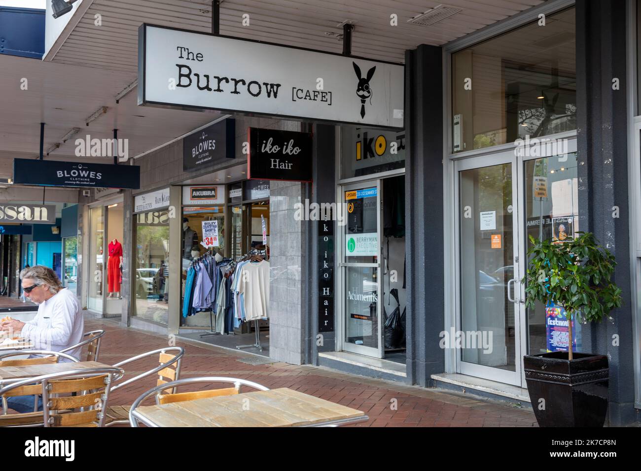 Orange city centre CBD, burrow cafe and clothes shops, man eating breakfast outside,NSW,Australia Stock Photo