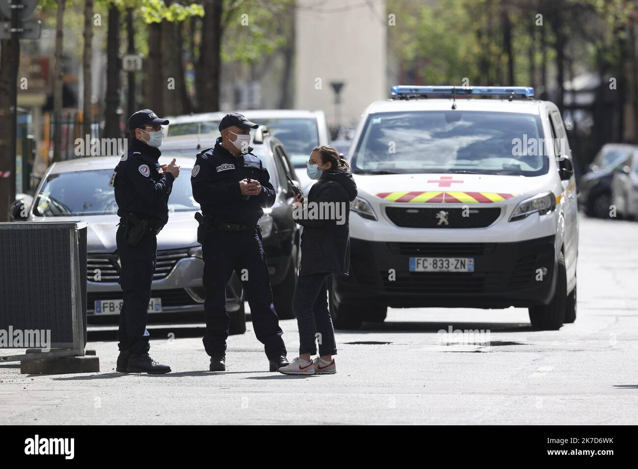 ©Sebastien Muylaert/MAXPPP - French police officers secure a street near the Henri Dunant hospital where two people have been shot n Paris. One person was dead, another was injured and being treated. The gunman fled on a motorcycle. The motive for the attack is still unknown. 12.04.2021 Stock Photo
