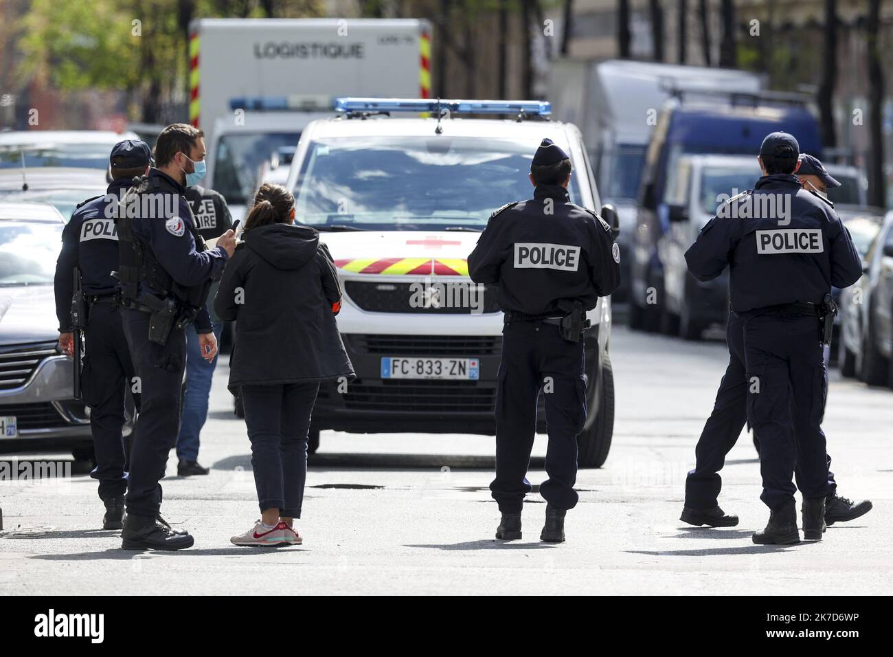 ©Sebastien Muylaert/MAXPPP - French police officers secure a street near the Henri Dunant hospital where two people have been shot n Paris. One person was dead, another was injured and being treated. The gunman fled on a motorcycle. The motive for the attack is still unknown. 12.04.2021 Stock Photo