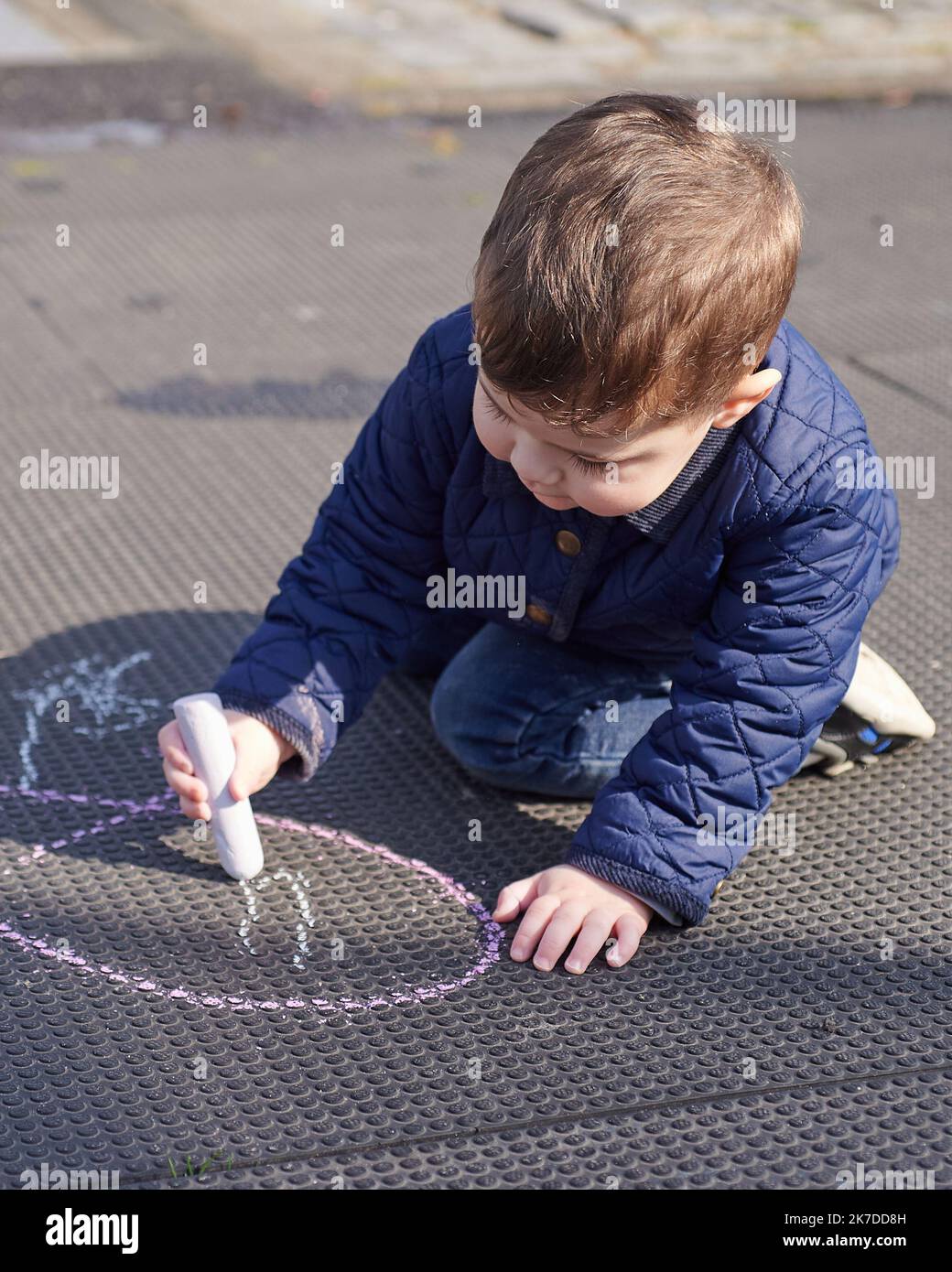 kids drawing in chalk on the playground Stock Photo - Alamy