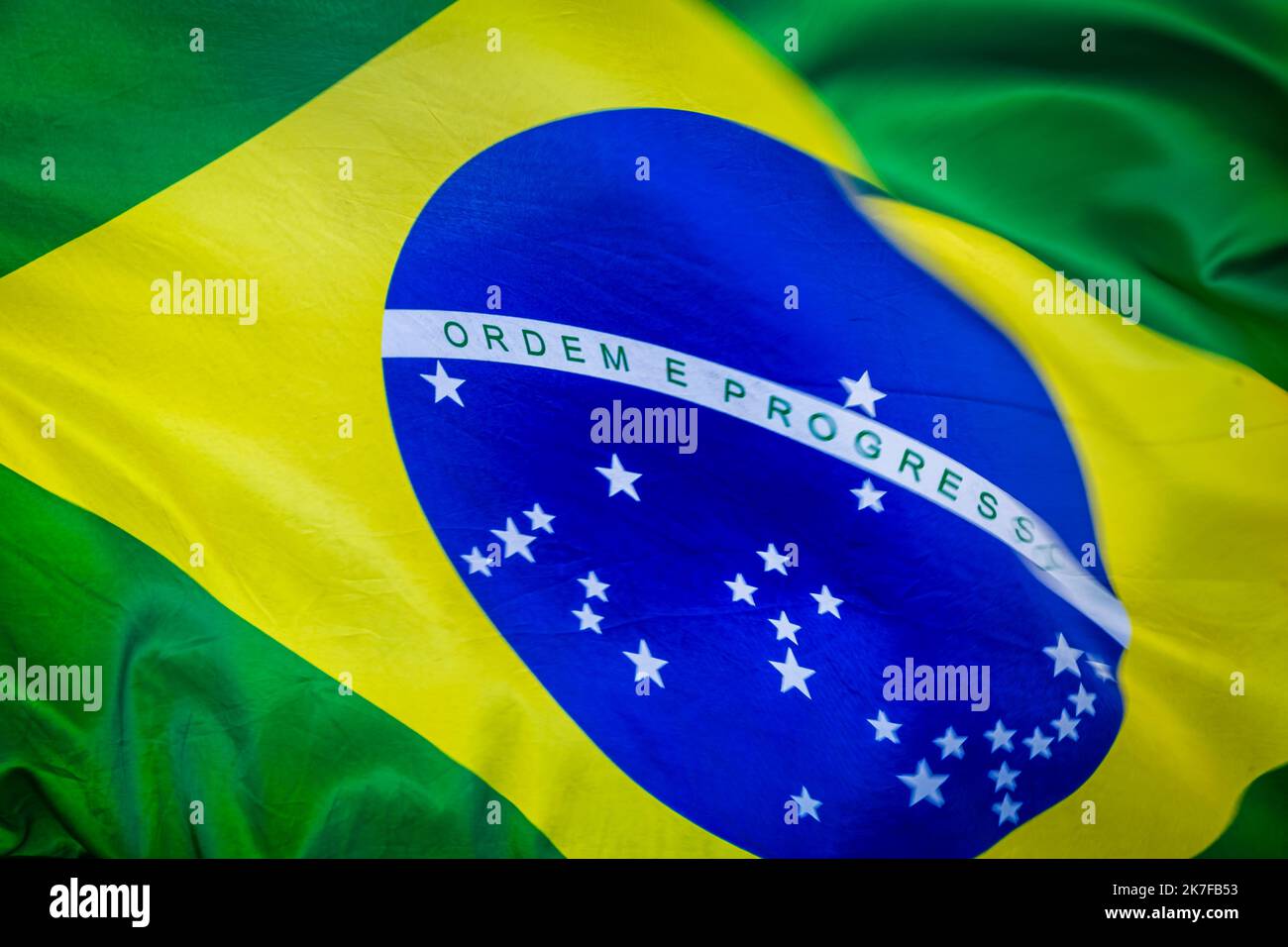 National flag of Brazil blowing on blue sky in Brasilia, South America ...