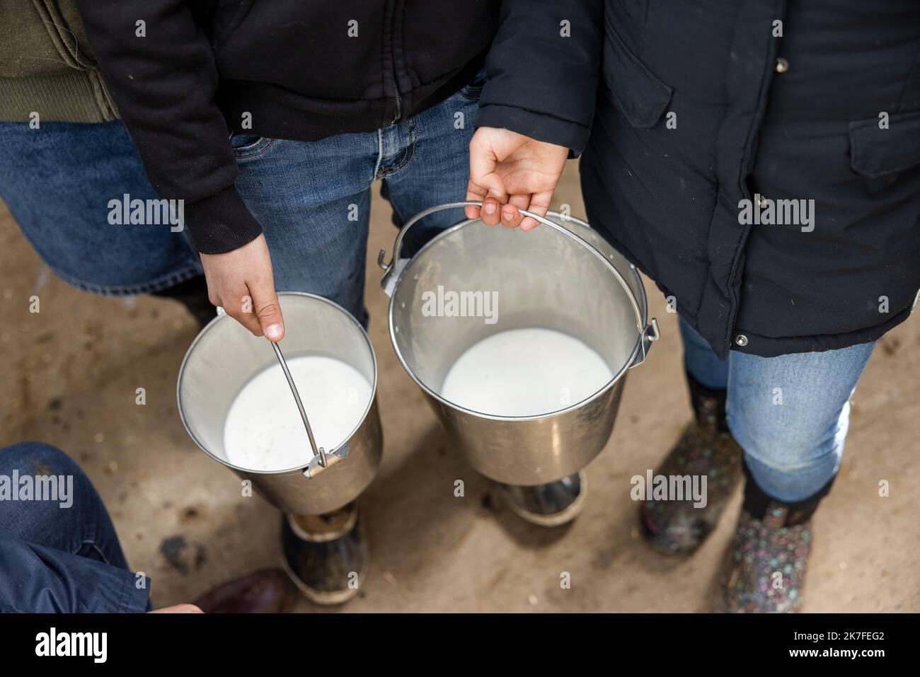 Farmers holding milk buckets Stock Photo Alamy