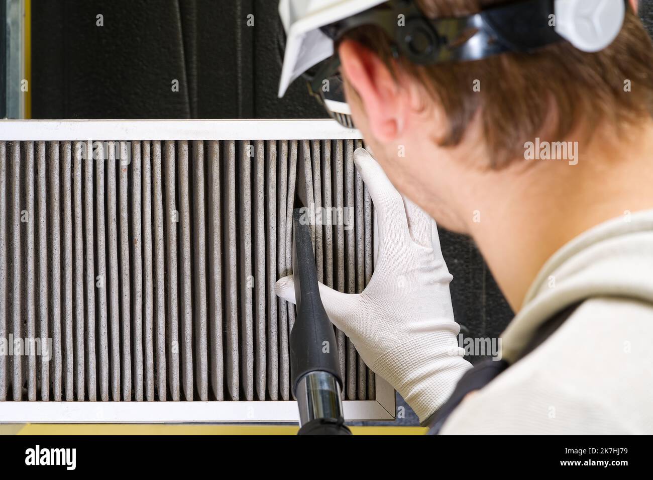 hvac filter replacement home central air system. servicemen changing