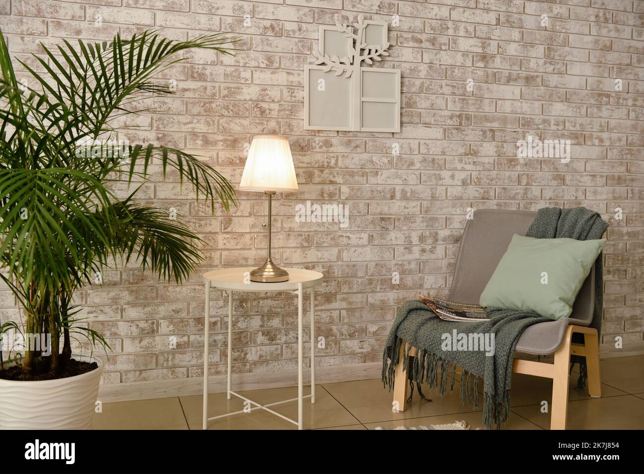 Cozy interior of room with armchair and family tree photo frame Stock ...
