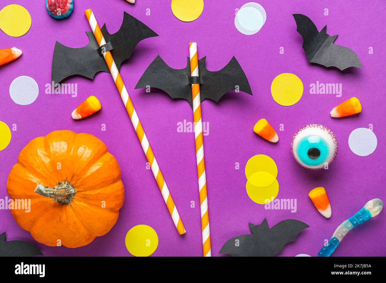 Paper Bats With Straws Candy Corns And Halloween Decor On Purple Paper Bats With Straws Candy Corns And Halloween Decor On Purple