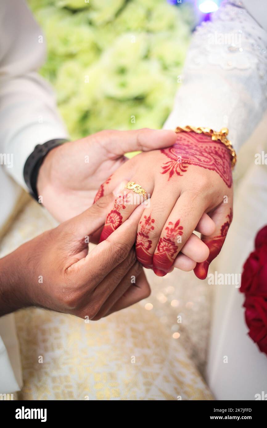 Wedding engagement rings. Married couple exchange wedding rings at a