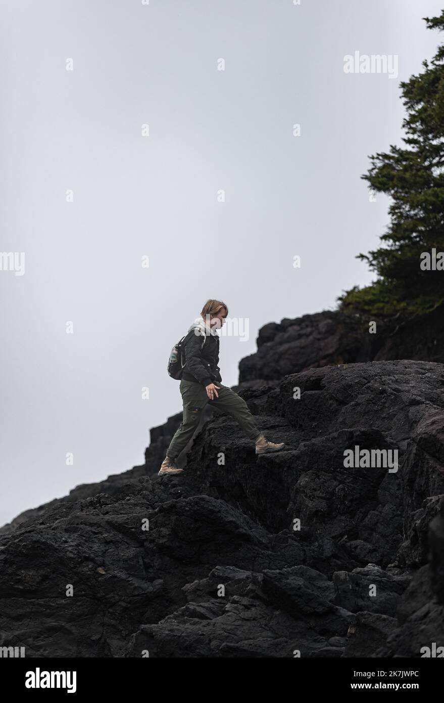 Woman walks on rocky mountain hi-res stock photography and images - Alamy