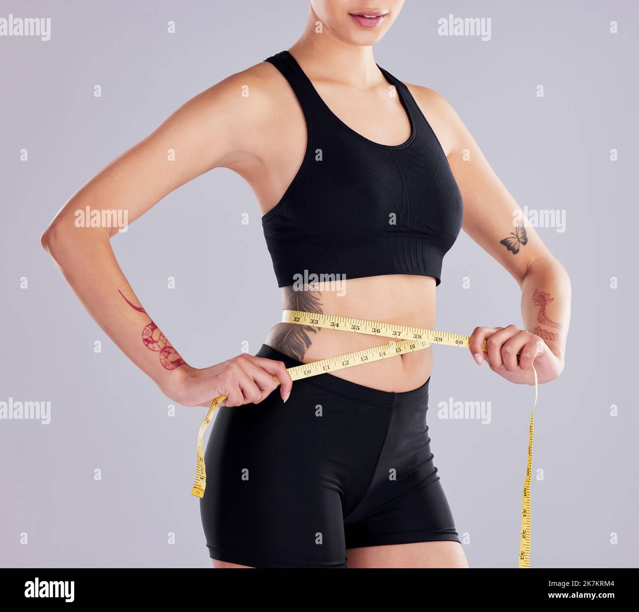 Woman with measuring tape. Weight loss concept. Woman take waist scale tape  show her thin waist. Slim girl with centimeter. Closeup woman measuring  Stock Photo - Alamy