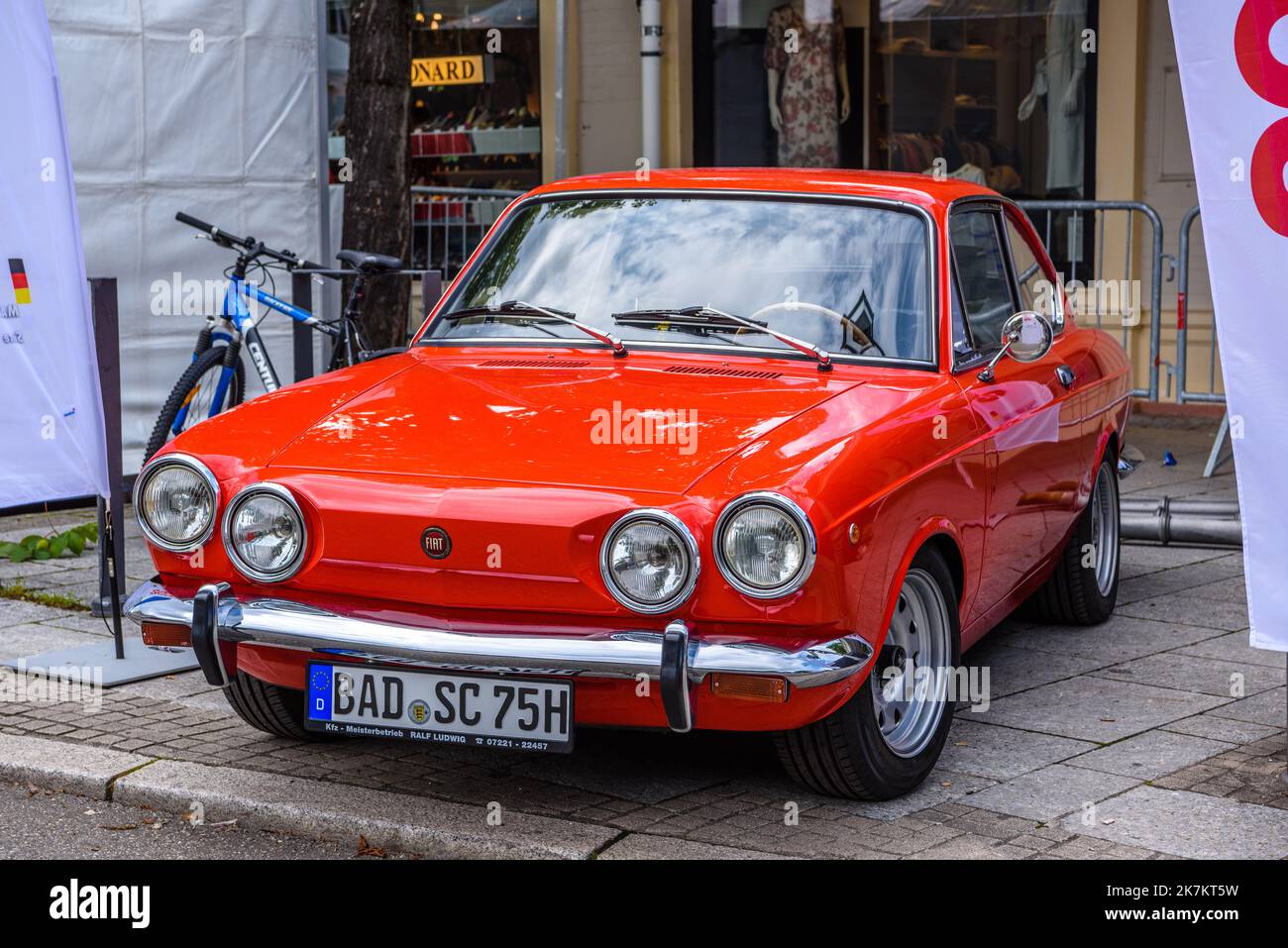 BADEN BADEN, GERMANY - JULY 2019: red FIAT 850 Sport Coupe from 1971 1964 1973, oldtimer meeting in Kurpark. Stock Photo