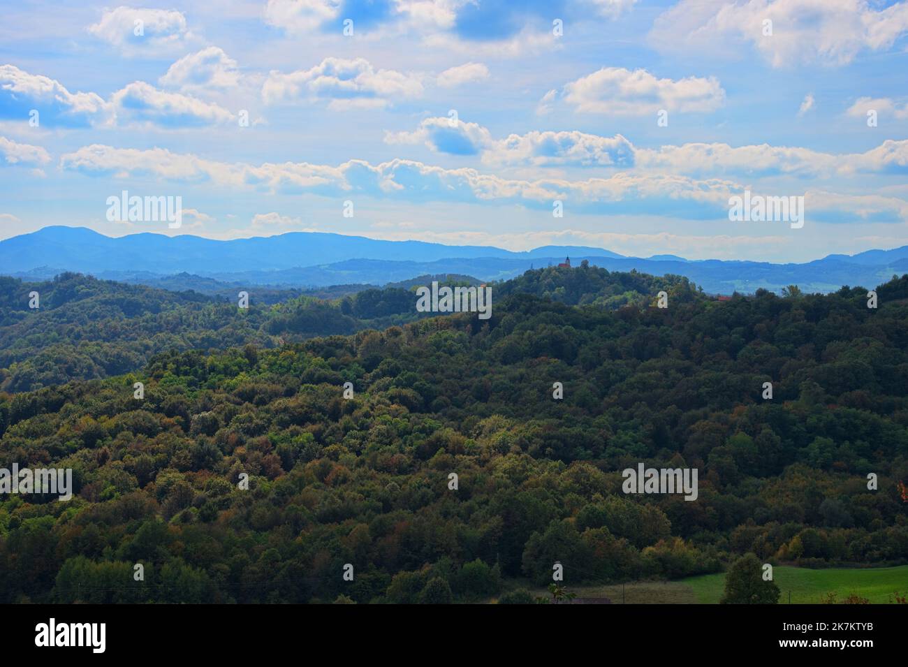 Scenic view of forest and mountains in autumn colors Stock Photo