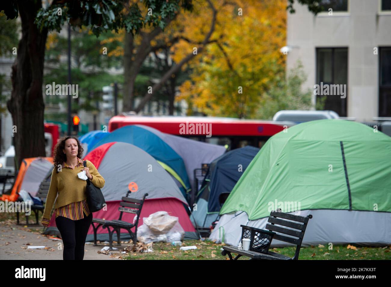 During the morning rush hour people pass by the homeless in mcpherson