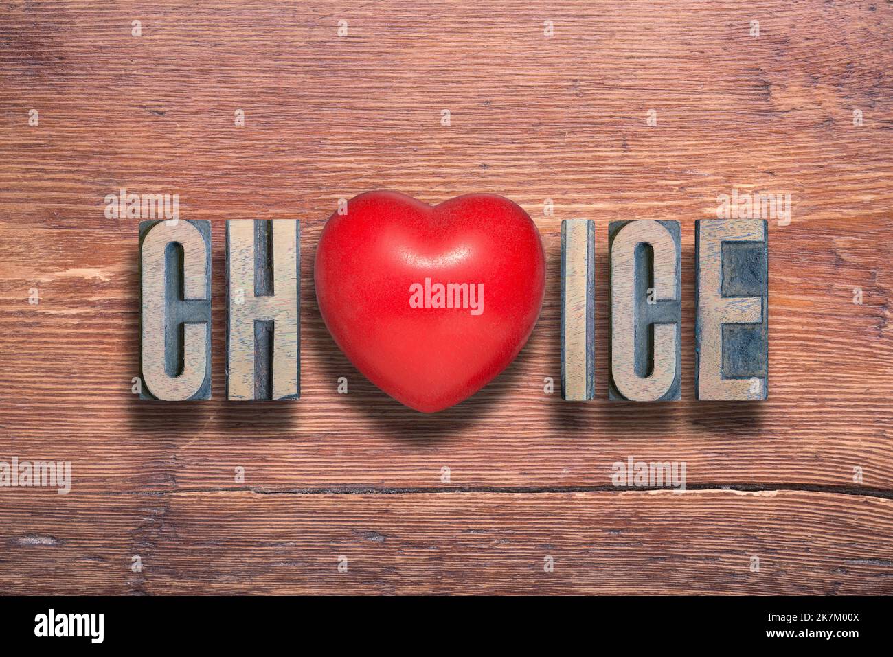 choice word combined on vintage varnished wooden surface with heart symbol inside Stock Photo