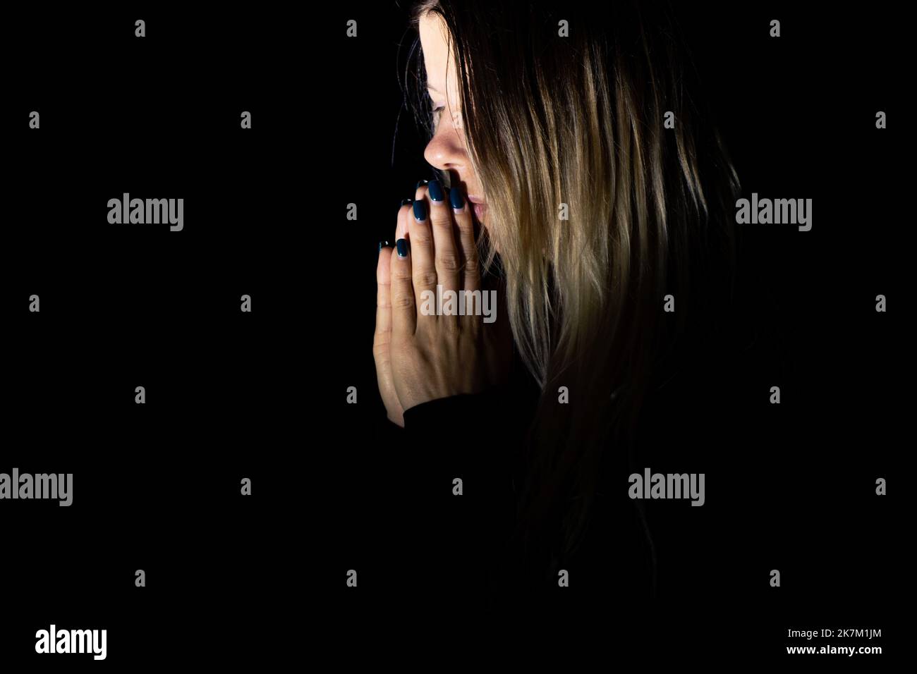 young girl praying to god in the dark, young girl in the dark, religion