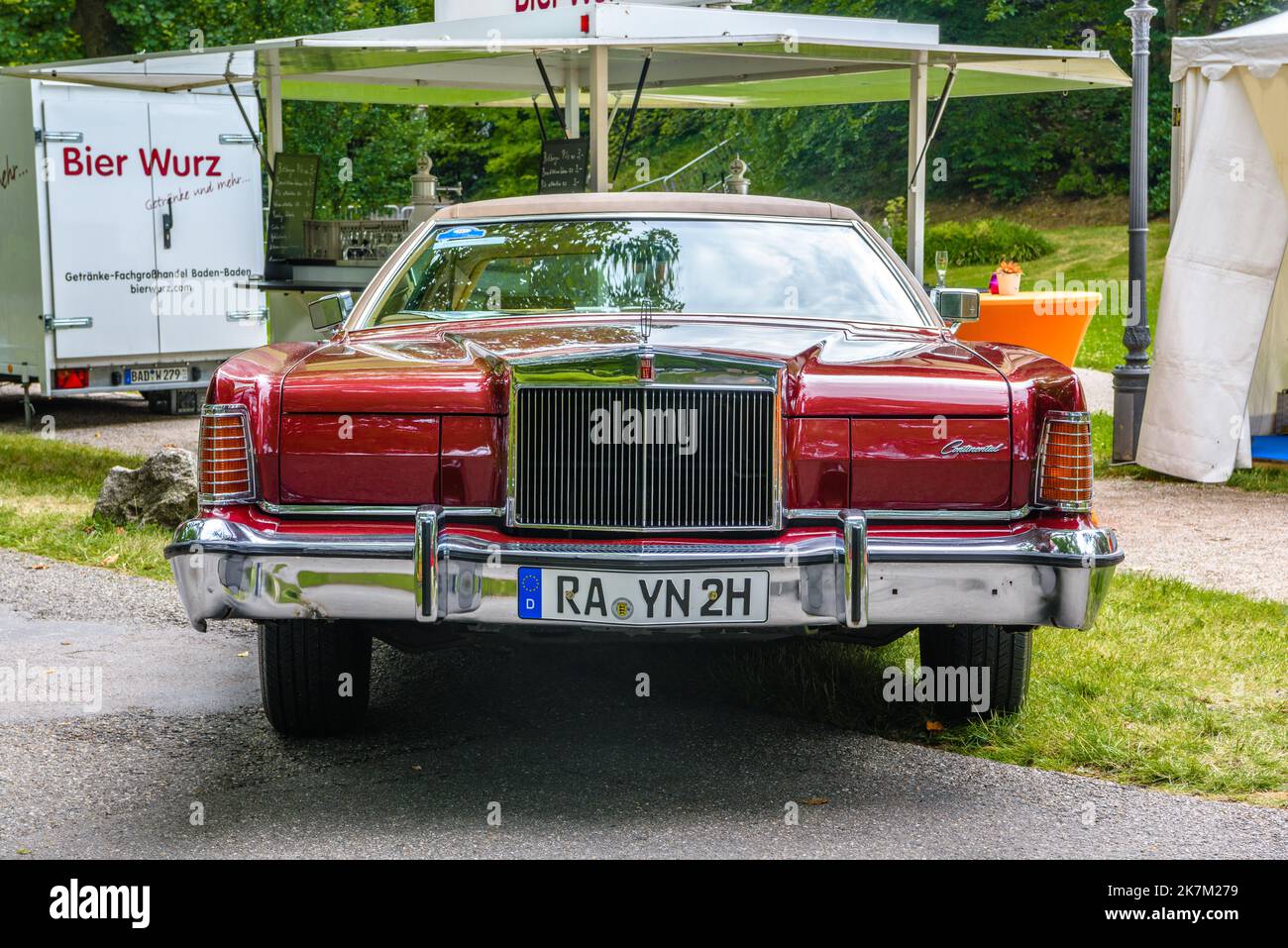 BADEN BADEN, GERMANY - JULY 2019: red maroon LINCOLN CONTINENTAL MARK IV full-size cabrio car 1972 1976, oldtimer meeting in Kurpark. Stock Photo