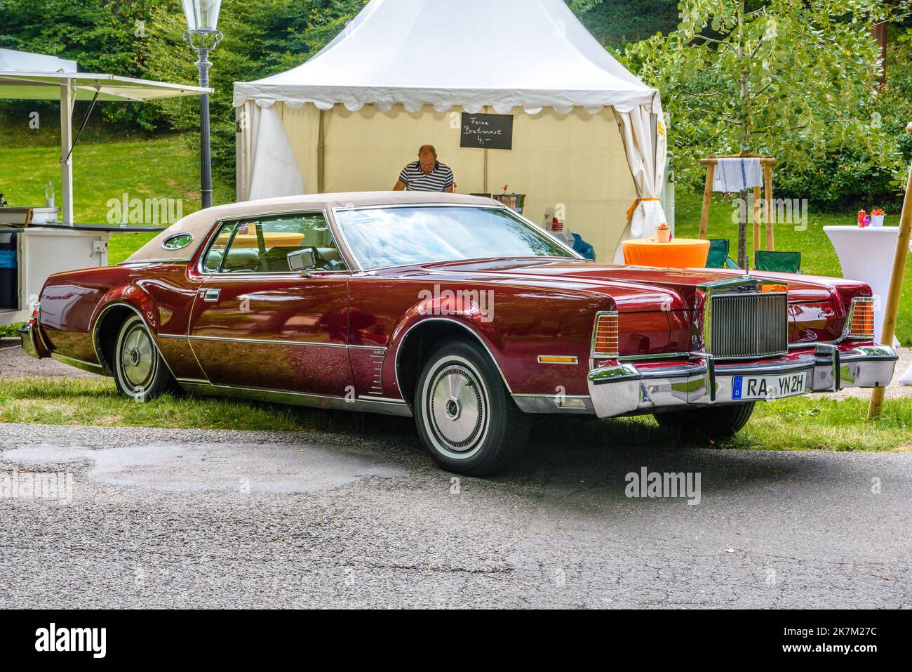 BADEN BADEN, GERMANY - JULY 2019: red maroon LINCOLN CONTINENTAL MARK IV full-size cabrio car 1972 1976, oldtimer meeting in Kurpark. Stock Photo