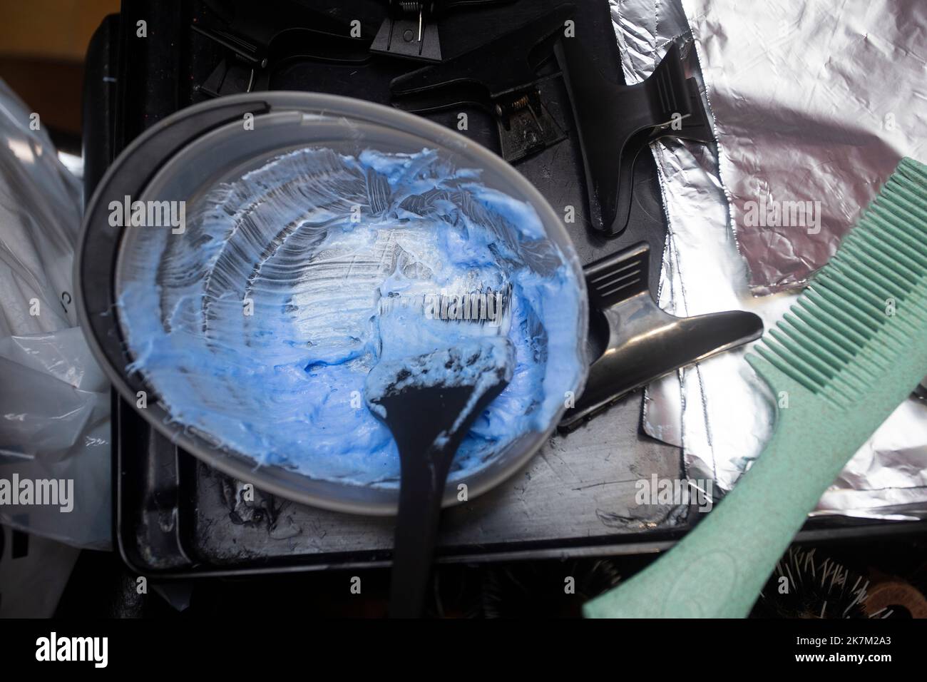 Bleaching woman's hair in the hairdressing salon Chemical dye Stock