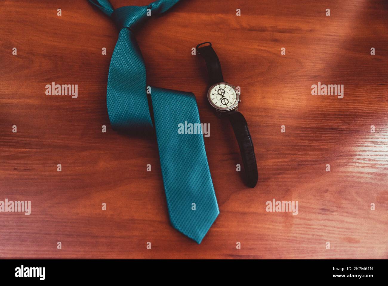 The groom's fees, a stylish man adjusts his jacket and watch Stock Photo
