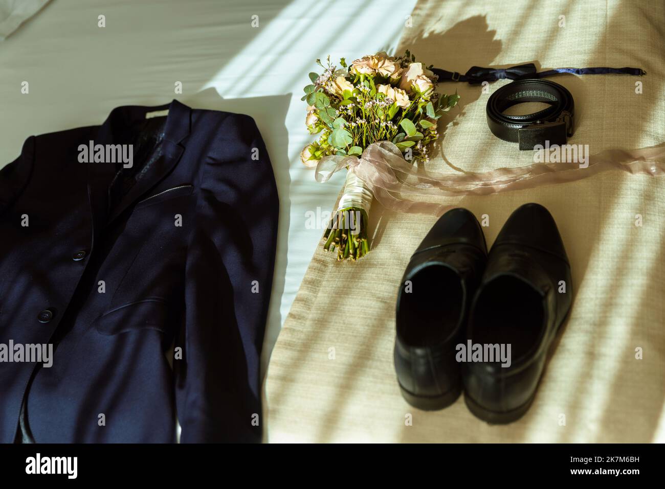 The groom's fees, a stylish man adjusts his jacket and watch Stock Photo