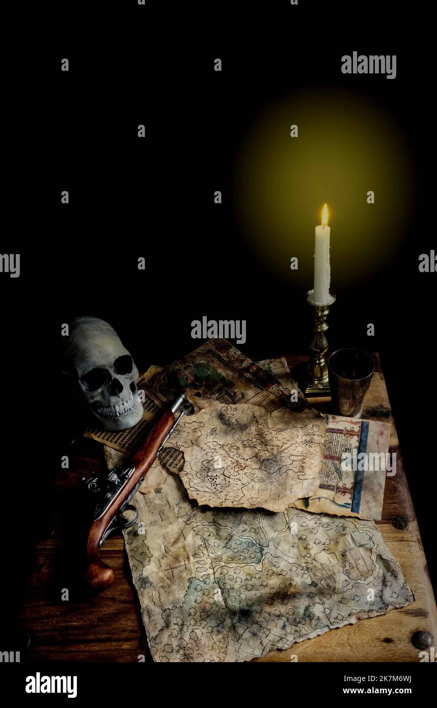 pirate table, candlelight with old maps, flintlock pistol and skull book cover idea, Stock Photo