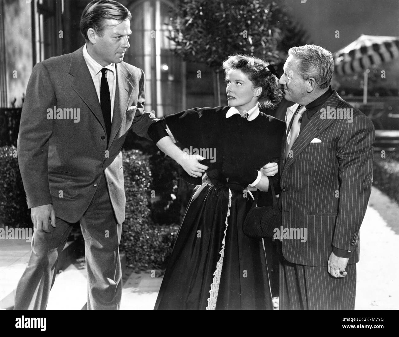 WILLIAM CHING KATHARINE HEPBURN and SPENCER TRACY in PAT AND MIKE 1952 director GEORGE CUKOR writers Ruth Gordon and Garson Kanin producer Lawrence Weingarten Metro Goldwyn Mayer Stock Photo